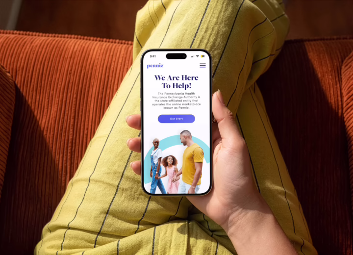 Person looking at Pennie website on the mobile phone