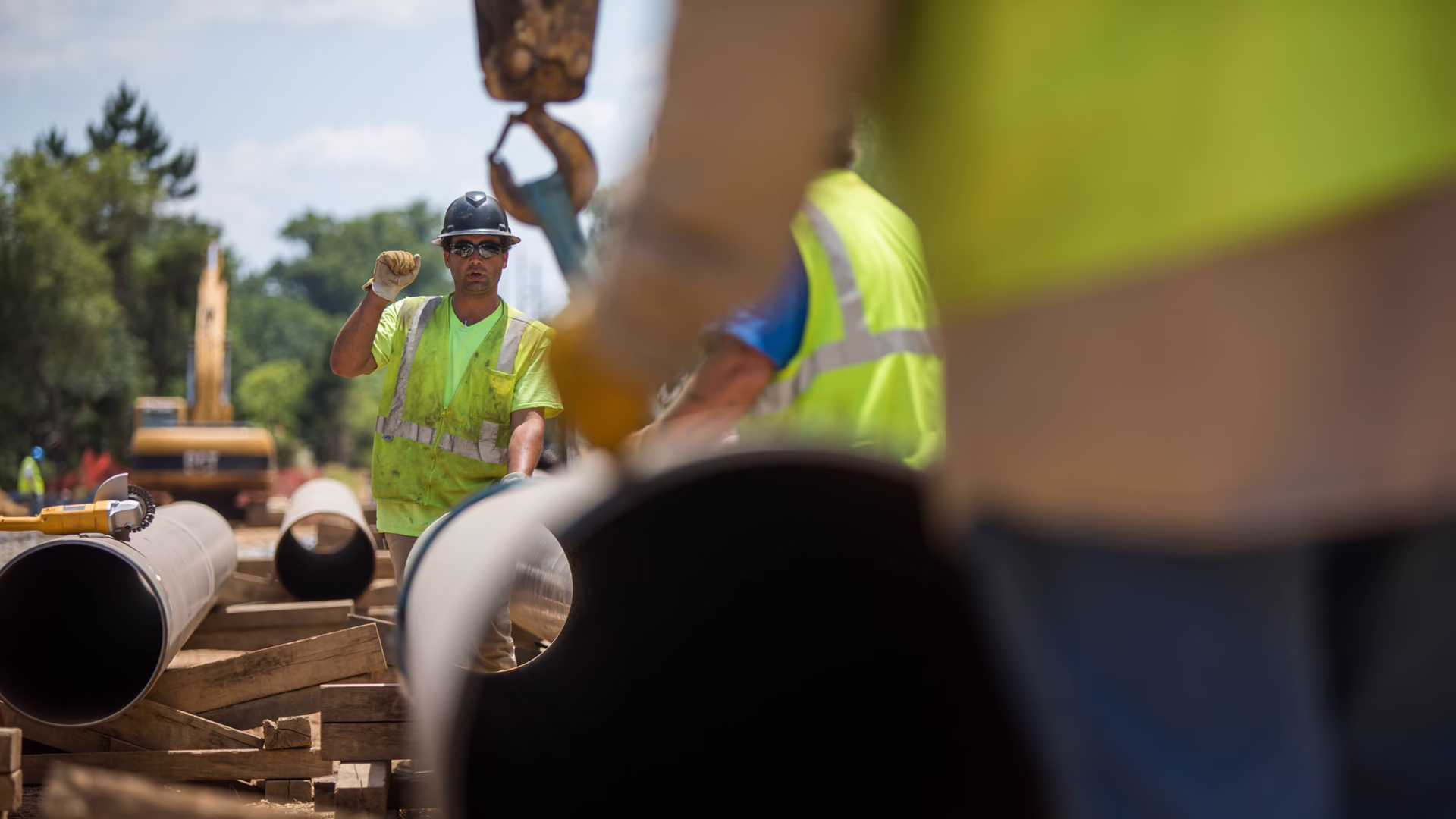 Construction workers building pipeline