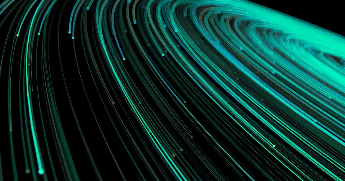 Data An abstract digital graphic featuring curved, glowing teal lines moving across a dark background representing data.