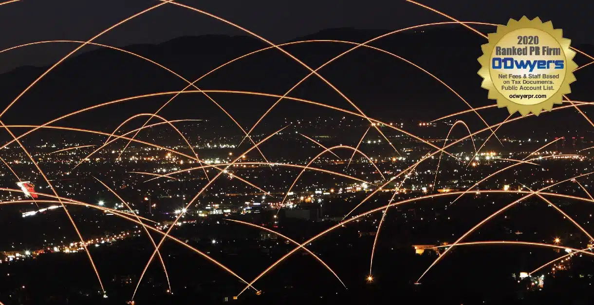A nighttime view of a city with golden arcs of light representing data connections, featuring an award seal in the corner.