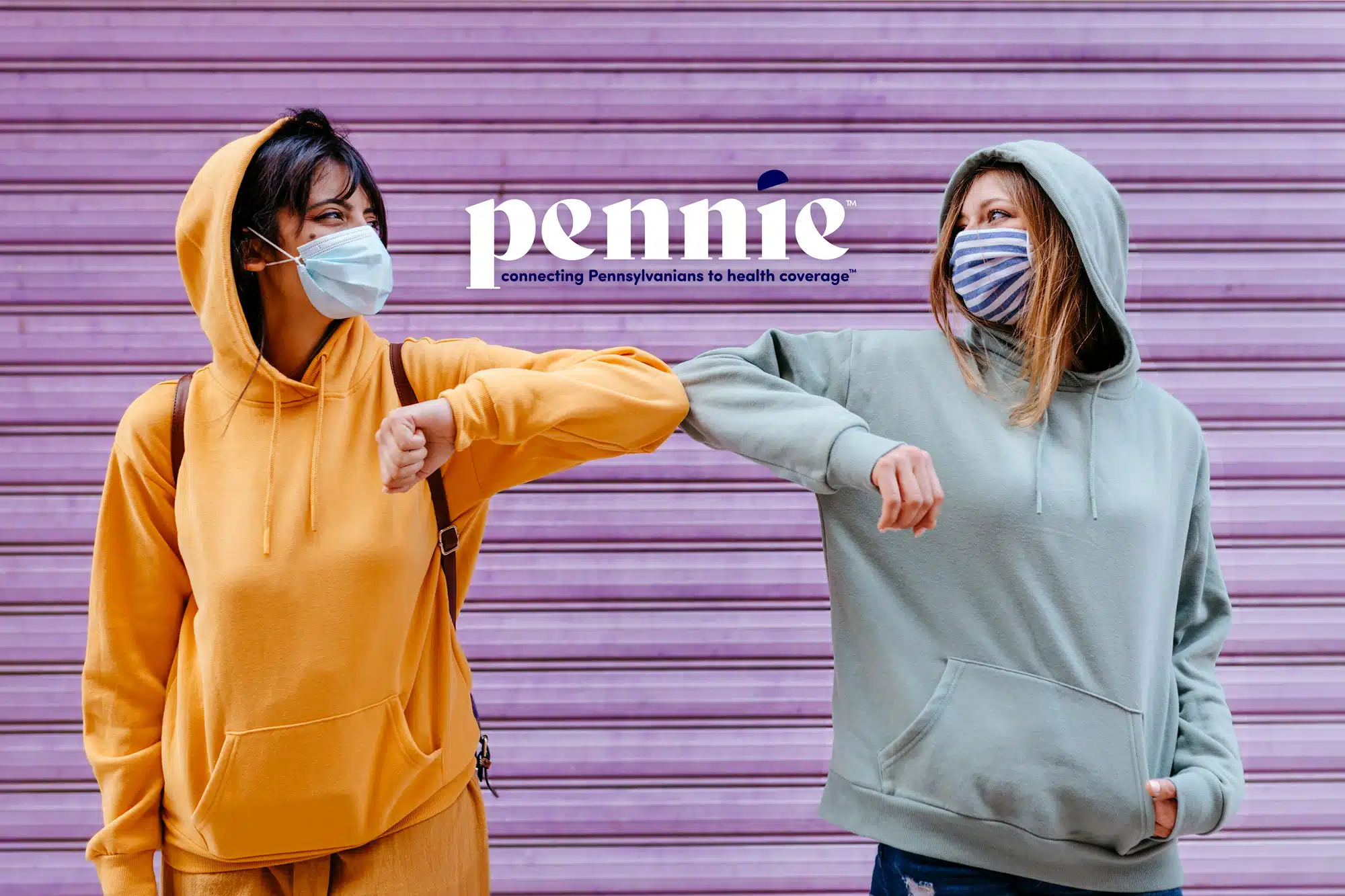 NameMastheadSmall Two people wearing hoodies and face masks touching elbows in front of a purple shutter door, featuring the "pennie" logo.